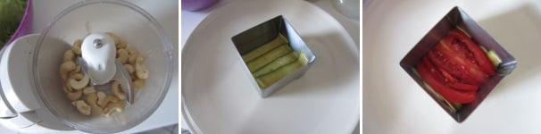 Mettete gli anacardi in un tritatutto e tritate finemente. Componete le lasagne usando un coppapasta quadrato. Disponetelo sul piatto e create il fondo con le zucchine, poi disponete sopra i pomodori.