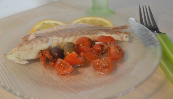 Dopo circa 25 minuti di cottura in forno statico a 180 gradi ecco pronto il vostro squisito branzino al cartoccio.