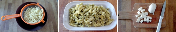 Nel frattempo cuocete la pasta in abbondante acqua salata e scolatela al dente. Conditela con il pesto. Mescolate per insaporire per bene la pasta. Mentre si raffredda, tagliate a dadini la mozzarella e il pomodoro.