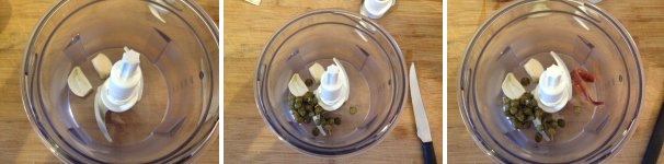 Poi mettete nel frullatore l’aglio tagliato in due e privato dall’anima verde, i capperi e i filetti di acciuga.