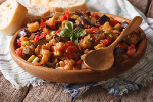 Sicilian Caponata with eggplants close-up on a plate. Horizontal caponata